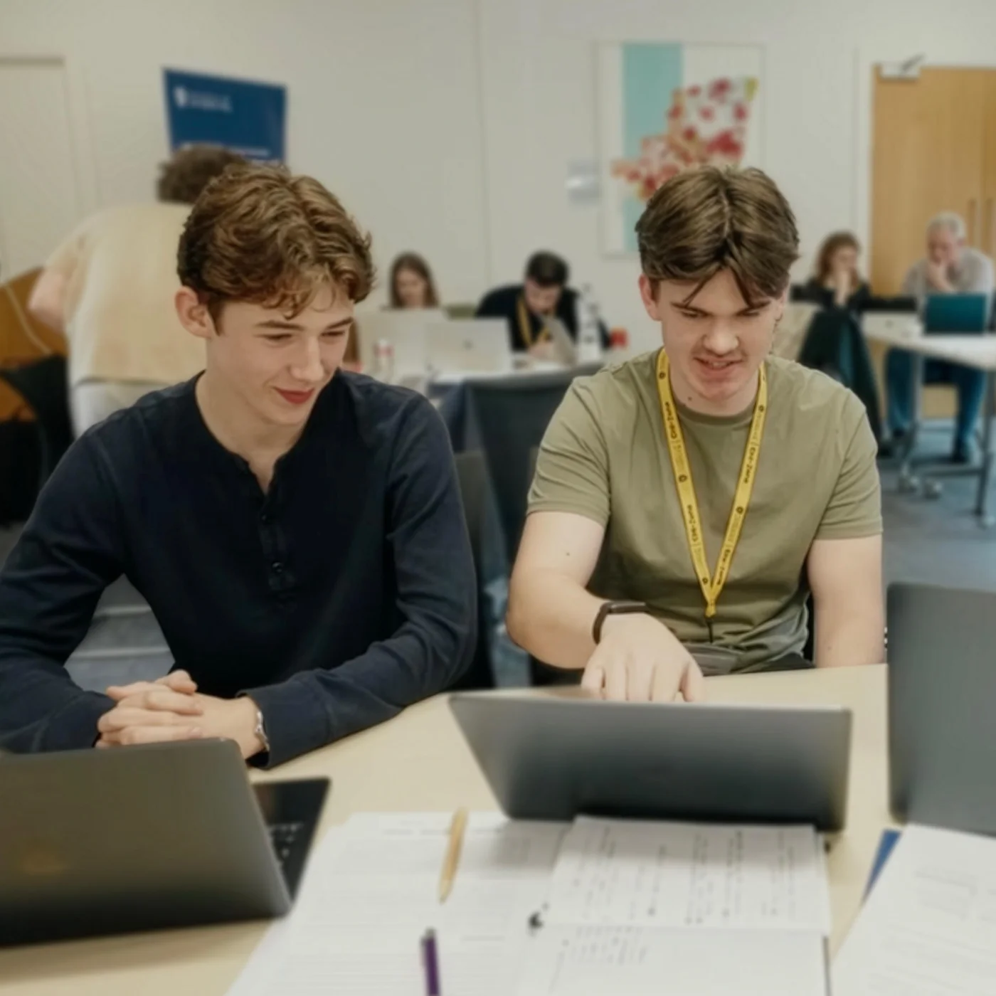 Rory Murray and Ollie Darwin working together at a laptop